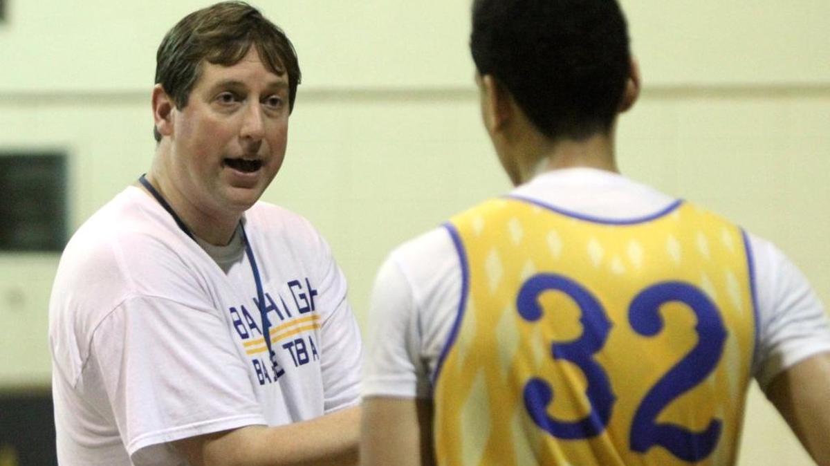 Bay High head basketball coach Randy McCrory talks to junior center Galen 'Tolu' Smith III during practice at the Tiger Dome in Bay St. Louis on Feb. 9, 2017.
