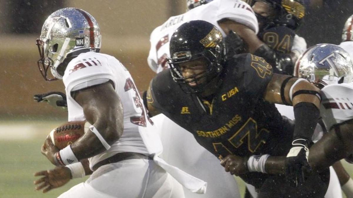 Southern Miss defensive lineman LaDarius Harris slices through the Troy offensive line to stop Jordan Chunn on Sept. 17, 2016 at Roberts Stadium in Hattiesburg.