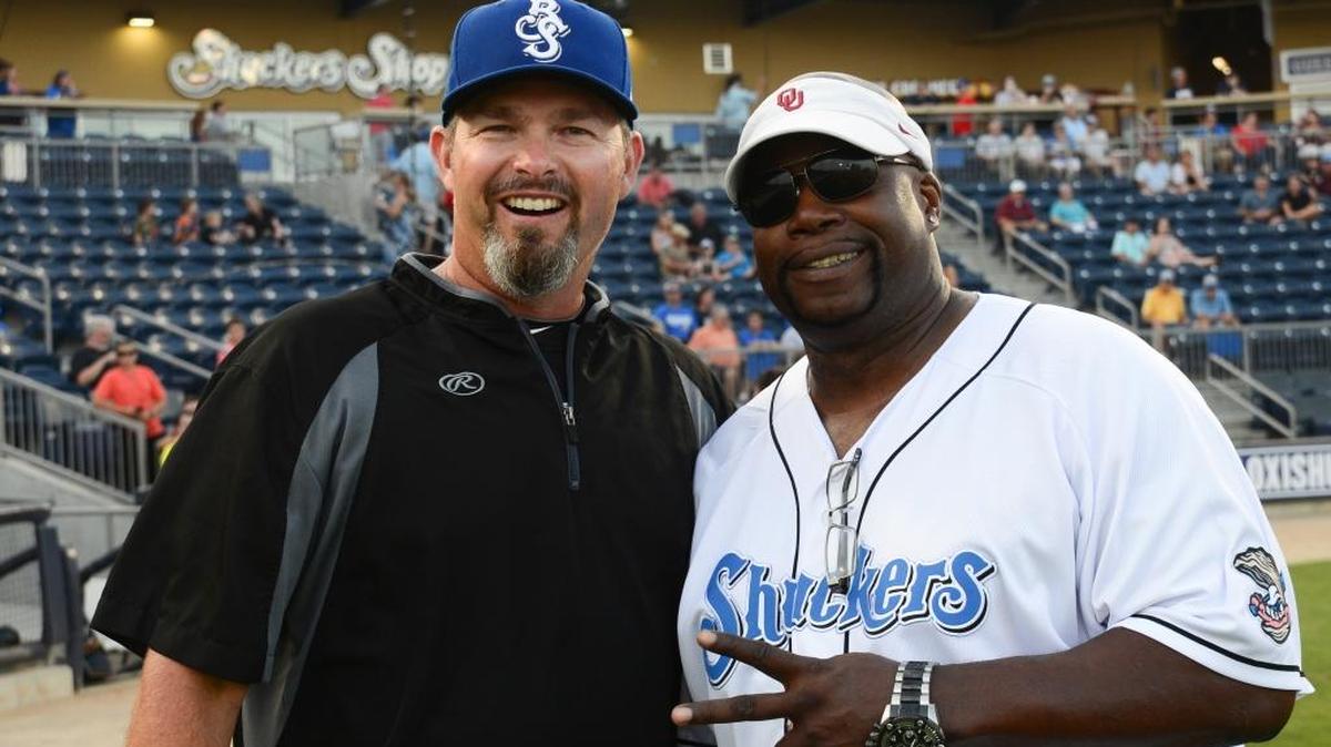 Marcus Dupree, right, poses for a photo with Biloxi Shuckers pitching coach Chris Hook Tuesday at MGM Park in Biloxi. Dupree is a former football star at Oklahoma and Philadelphia High School.