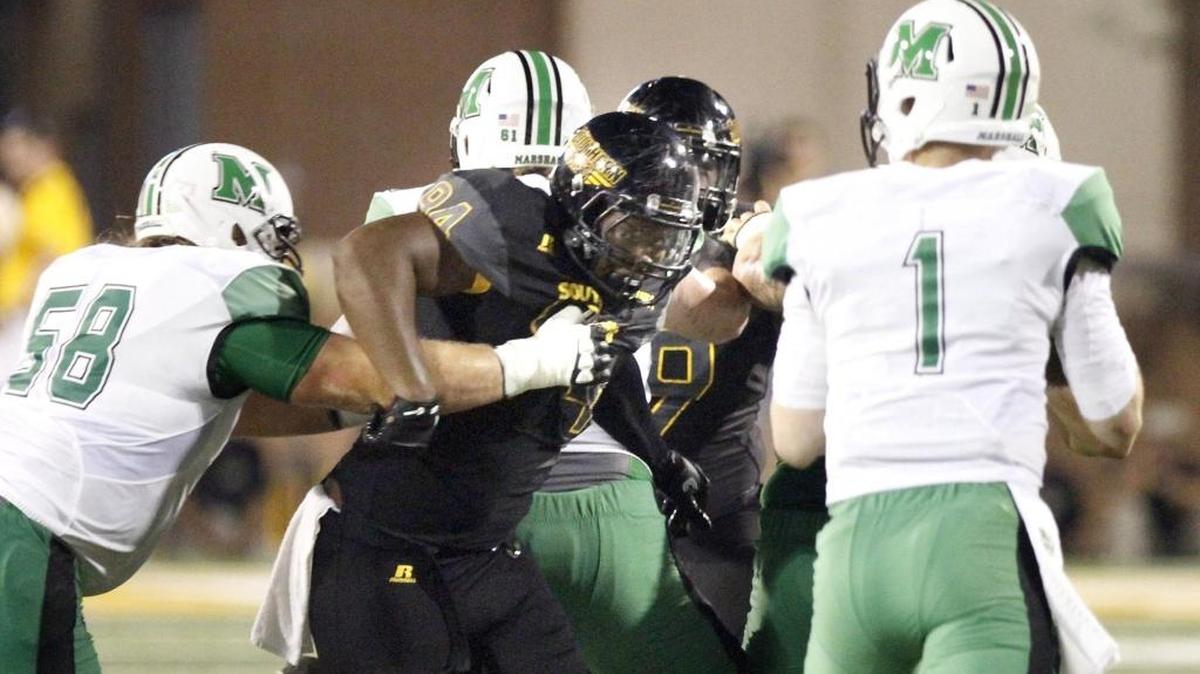 Dylan Bradley of Southern Miss splits the blockers on Marshall's offensive line to pressure quarterback Chase Litton on Oct. 29, 2016, at M. M. Roberts Stadium in Hattiesburg.