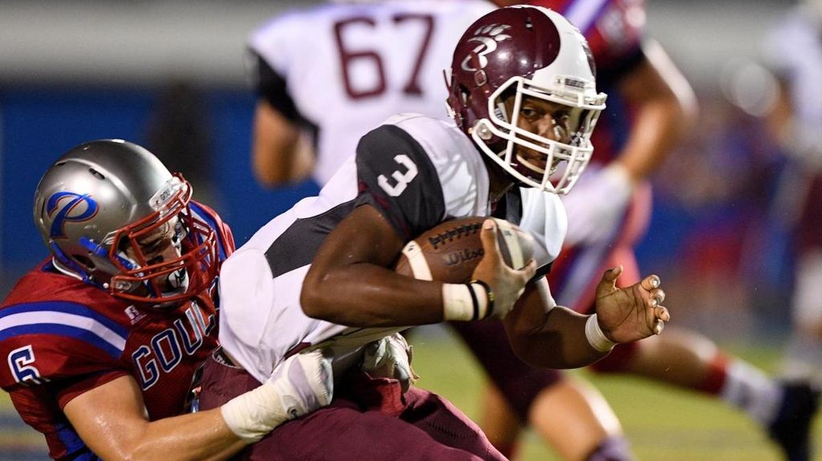 Long Beach quarterback Jaidon Evans (3) is sacked by Pascagoula's Alden Davis (6) during the first quarter, Friday, Sept. 23, 2016, at Pascagoula High School in Pascagoula.