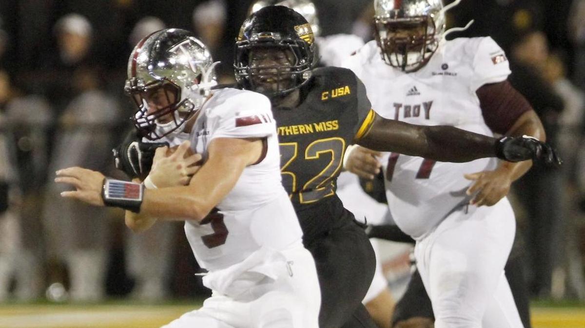 Southern Miss defensive end Xavier Thigpen sacks Troy quarterback Sawyer Smith on Sept. 17 in Hattiesburg.