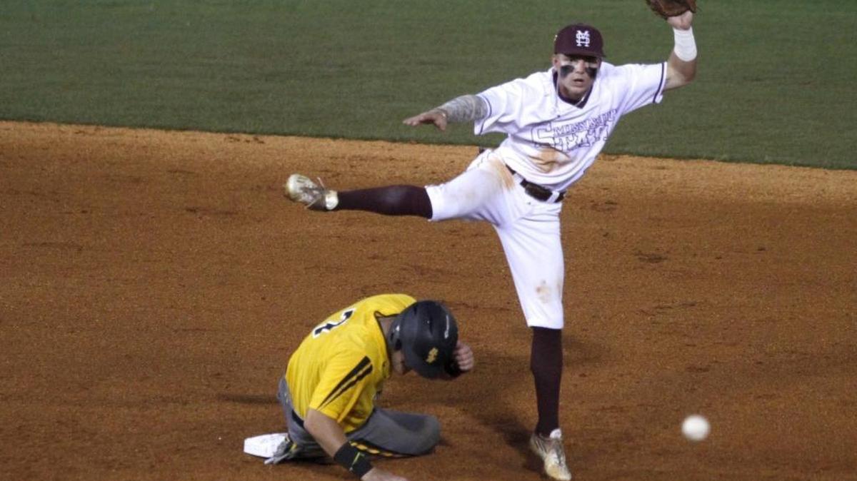 Mississippi State second baseman Hunter Stovall tries to turn a double play as he leaps over Southern Miss runner Matthew Guidry during Hattiesburg Regional Tournament on June 5, 2017.