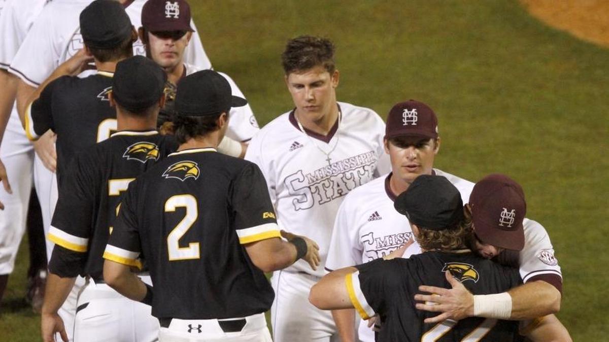 Southern Miss and Mississippi State players hug after playing two games at the Hattiesburg Regional Tournament on June 5 in Hattiesburg. MSU won both games to advance to the Super Regional at LSU.
