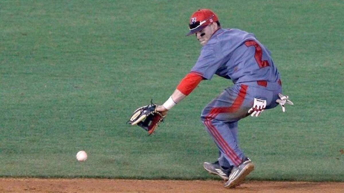 Hancock shortstop Landon Jordan fields a ground ball against Harrison Central, March 31, 2016. Jordan played through injury during much of his junior season in 2017.
