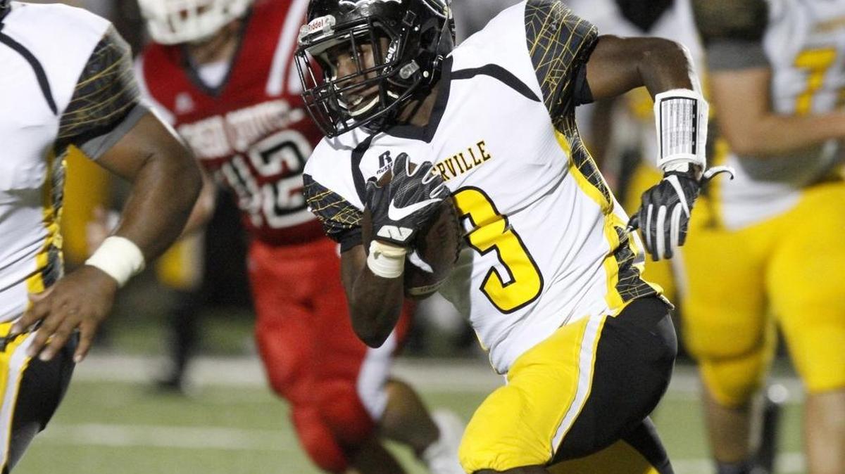 D'Iberville's Ja'Quavis Foster rushes for a first down against Harrison Central, Friday, Oct. 28, 2016 in Gulfport. The Warriors currently lead Region 4-6A, with the regular season finale against St. Martin set for Friday.