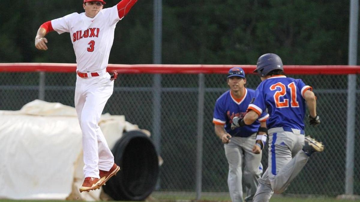 Gulfport's Beckett White is safe at first as Biloxi's Jordon O'Keefe reaches for an errant throw during the first inning of their game at Biloxi on Tuesday, March 28, 2017.