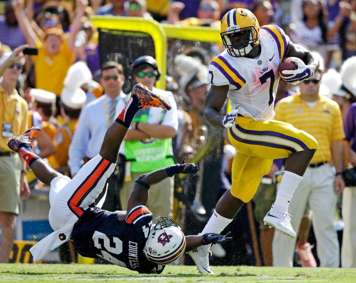 LSU running back Leonard Fournette (7) runs past Auburn defensive back Blake Countess (24) on a touchdown run in the first half of an NCAA college football game in Baton Rouge, La., Saturday, Sept. 19, 2015.
