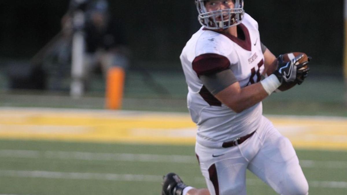 Picayune fullback Blake Merrifield turns upfield on a swing pass during the first quarter of their game against D'Iberville at Warrior Stadium in D'Iberville on Friday Aug. 26, 2016.