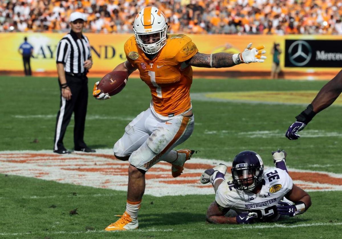 Tennessee running back Jalen Hurd (1) slips away from Northwestern linebacker Nate Hall (32) during the third quarter of the Outback Bowl NCAA college football game Friday, Jan. 1, 2016, in Tampa, Fla.