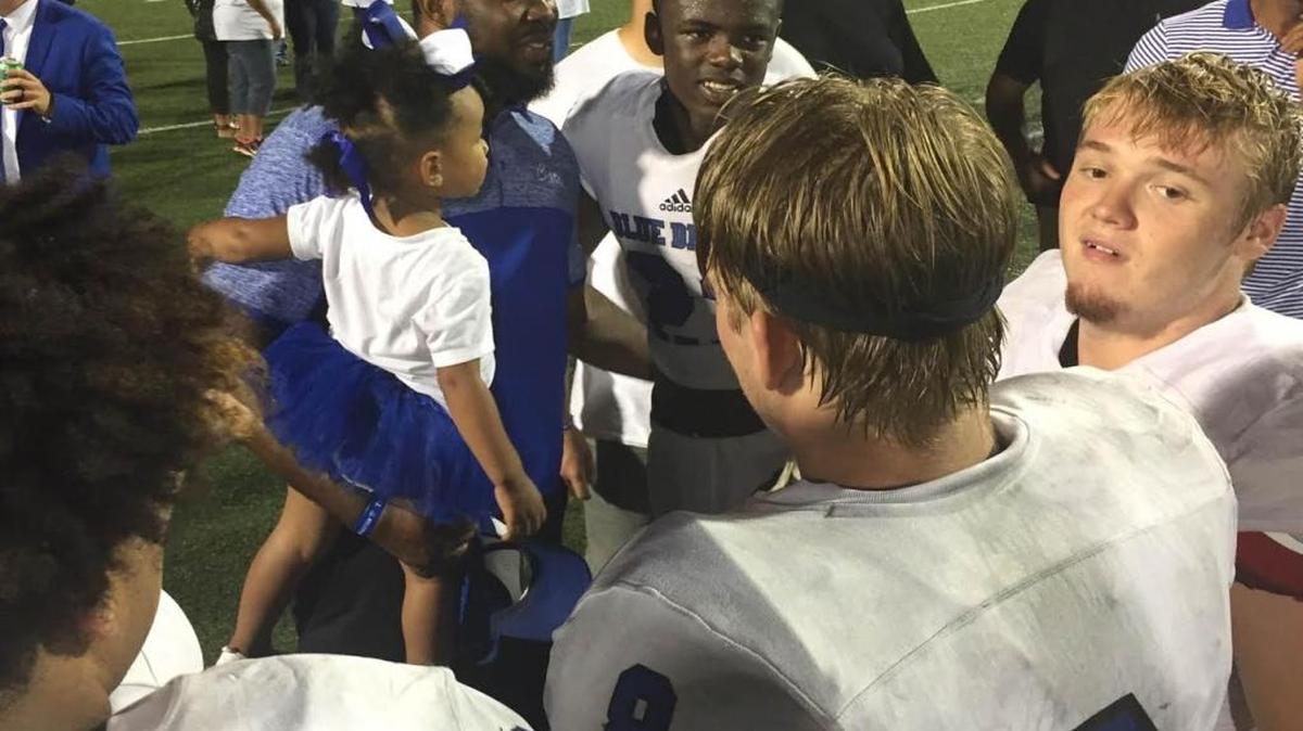 Stone High football coach John Feaster, middle, is congratulated by his former players at Pearl River Central after the Tomcats defeated the Blue Devils 49-19 on Friday at A.L. May Memorial Stadium.