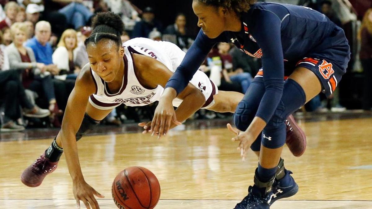 Mississippi State guard Morgan William (2) dives for loose ball in front of Auburn guard Erica Sanders (3) during the first half of an NCAA college basketball game in Starkville, Miss., Thursday, Feb. 22, 2018.