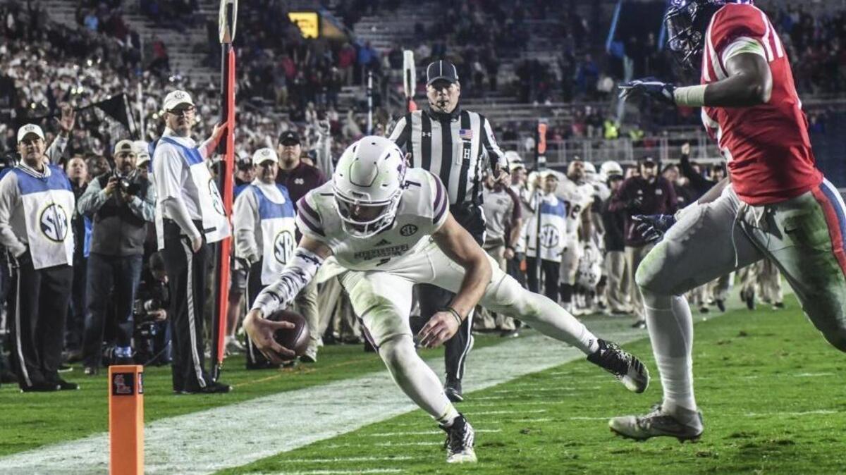 Mississippi State quarterback Nick Fitzgerald (7) scores during the second half of the Egg Bowl in Oxford on Nov. 26, 2016.