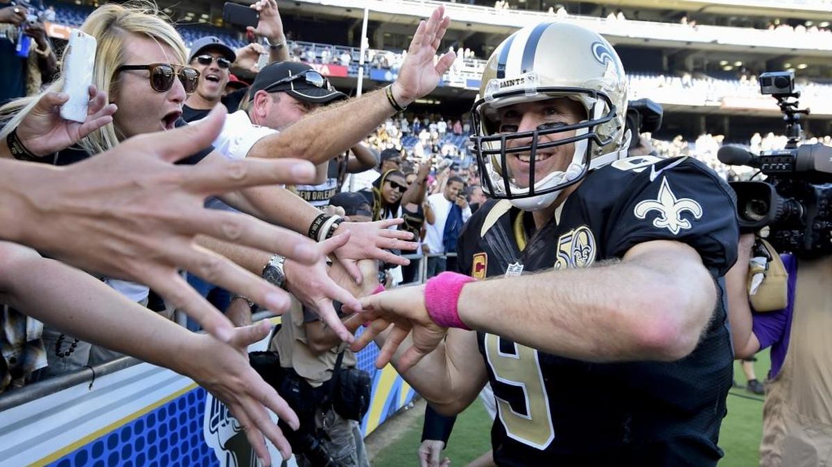 New Orleans Saints quarterback Drew Brees reacts with fans after the game against the San Diego Chargers Sunday, Oct. 2, 2016, in San Diego. The Saints won, 35-34.