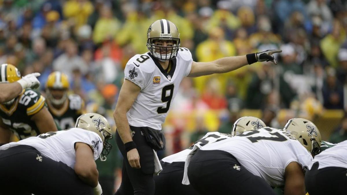 New Orleans Saints quarterback Drew Brees (9) calls a play during the first half of an NFL football game against the Green Bay Packers, Sunday, Oct. 22, 2017, in Green Bay, Wis.