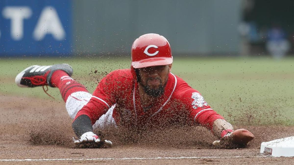 Cincinnati Reds' Billy Hamilton steals third base against the Chicago Cubs, April 23, in Cincinnati. The Reds won 7-5.