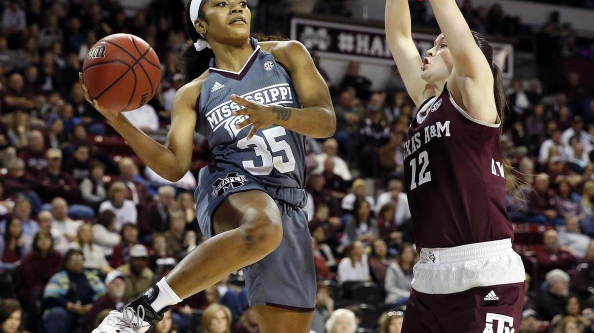 Mississippi State forward Victoria Vivians (35) tries to pass around Texas A&M guard Danni Williams (12) in Starkville, Jan. 29.