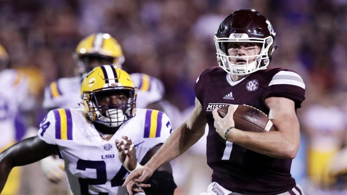 Mississippi State quarterback Nick Fitzgerald (7) sprints past LSU linebacker Tyler Taylor (24) for a first down during Saturday’s game against LSU in Starkville. Mississippi State won 37-7.