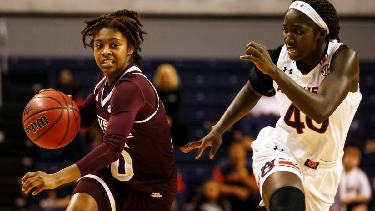 Mississippi State guard Jazzmun Holmes (10) brings the ball down as Auburn guard Khady Dieng (40) defends during the second half of an NCAA college basketball game on Feb. 2 in Auburn, Ala.
