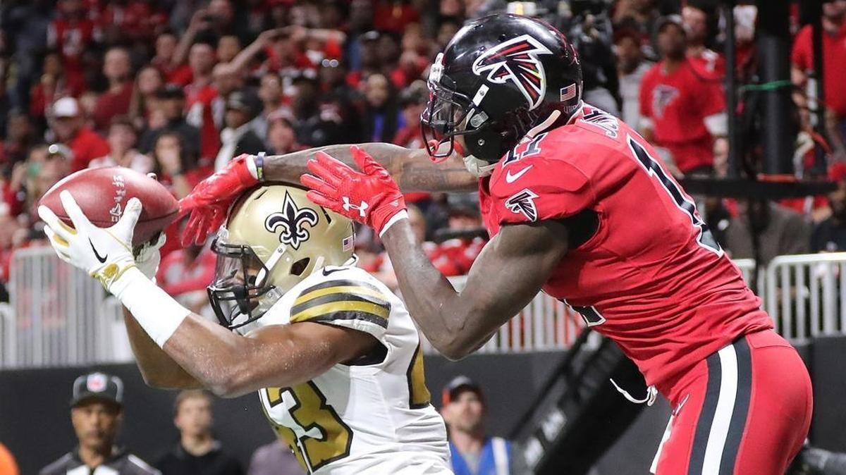 New Orleans Saints safety Marcus Williams intercepts the ball in front of Atlanta Falcons wide receiver Julio Jones in the end zone during the second quarter on Thursday, Dec. 7, 2017, in Atlanta, Ga.