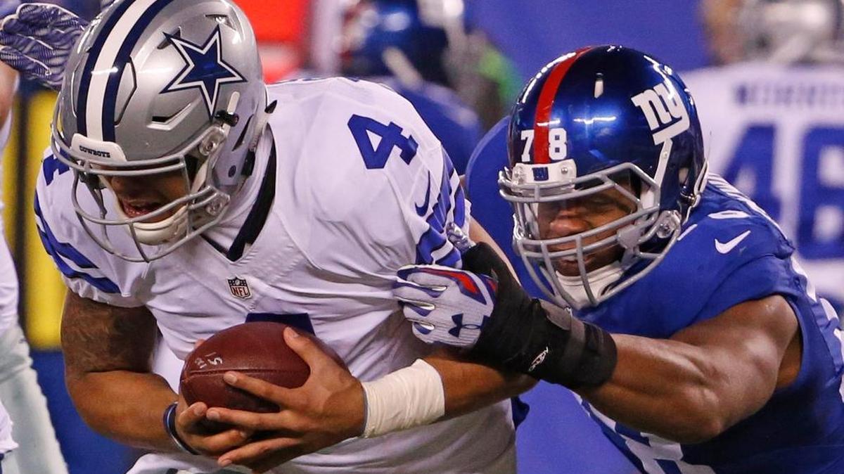 Dallas Cowboys quarterback Dak Prescott is sacked by New York Giants defensive end Romeo Okwara on Sunday at MetLife Stadium in East Rutherford, N.J.