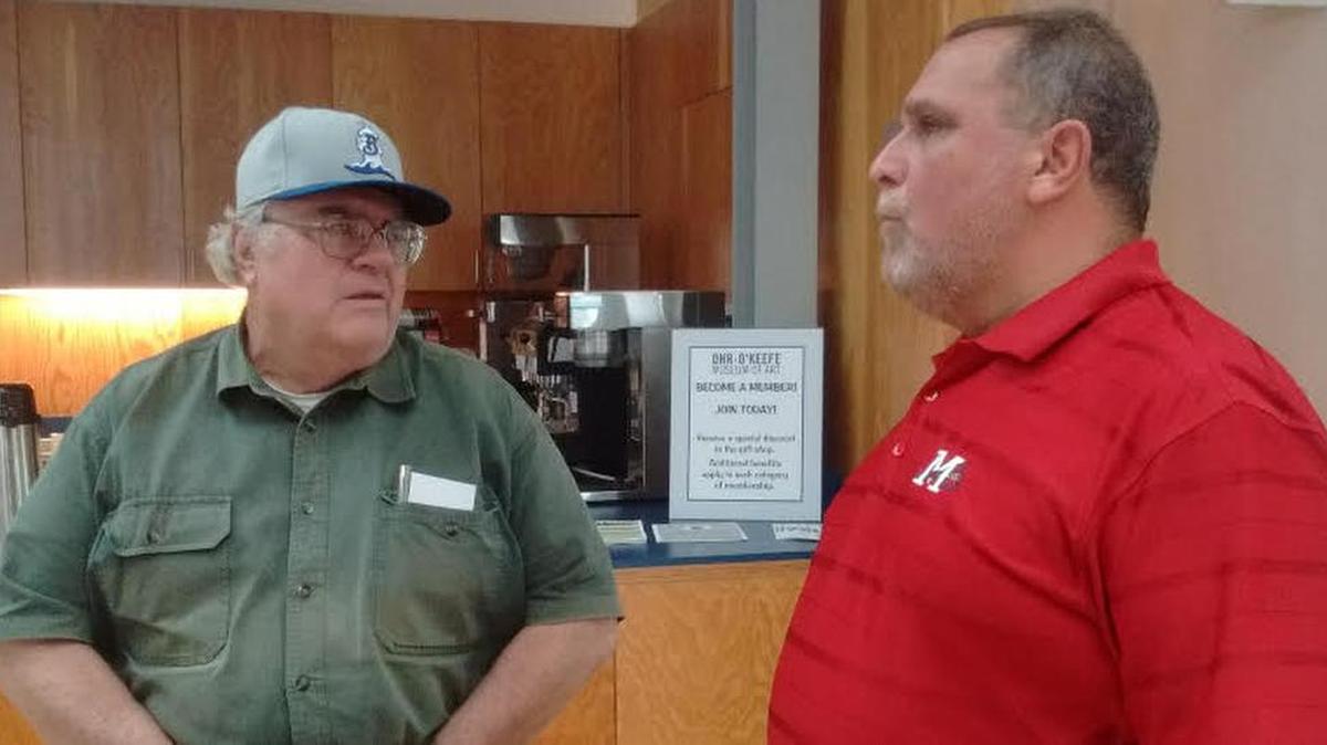 Local baseball historian Gary Higginbotham (left) speaks with long-time Mississippi Braves GM Steve DeSalvo Friday. DeSalvo has been the Braves AA General Manager since 1986.