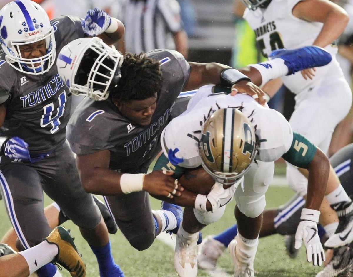Stone linebacker Jamir Jamison loses his helmet as he tackles Poplarville running back Auston Bolton during the first quarter of their game at A.L. May Stadium in Perkinston on Sept. 8. Photographer’s comment: In 30-plus years, I don’t remember getting a good helmet-flying shot. Now I have.