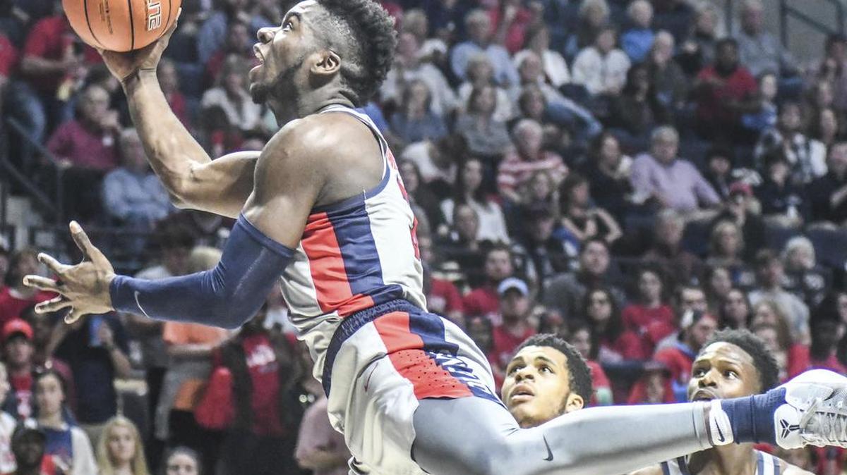 Ole Miss guard Terence Davis (3) scores against Mississippi State in Oxford, Tuesday.