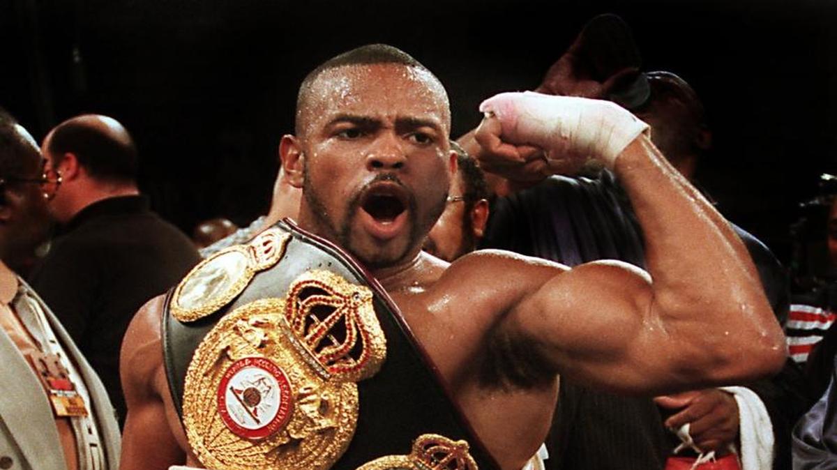 Roy Jones Jr. claims victory after winning the light heavyweight unification bout against Reggie Johnson on June 5, 1999.