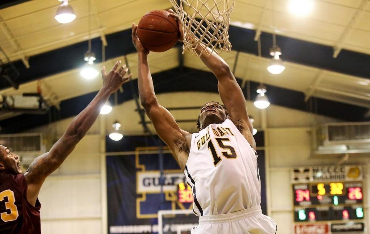 Mississippi Gulf Coast Community College’s Tedrian Brisco dunks the ball over the heads of Pearl River Community College opponents on Jan. 26. Photographer’s comments: I feel like the lighting and the composition elevate this shot above a standard basketball action photo.