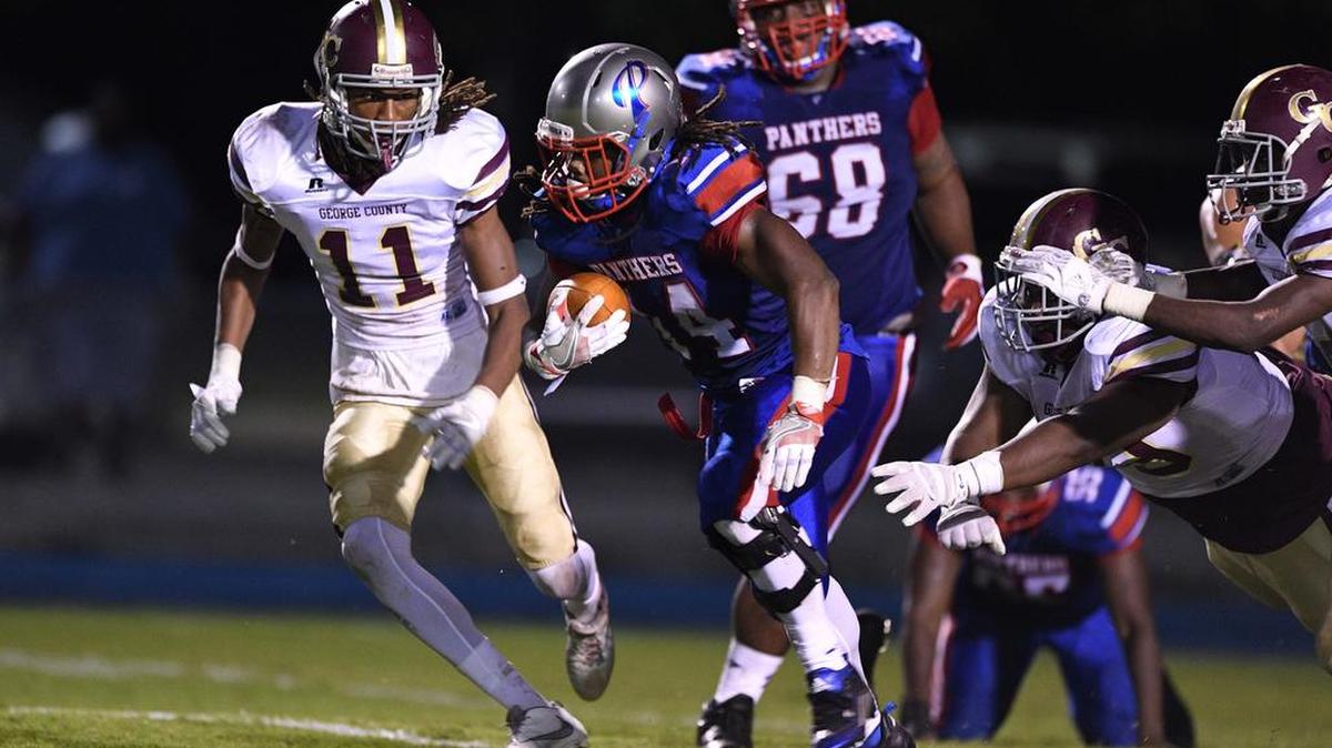Pascagoula's Javarous Walker (14) carries the ball against George County's Dylan Lawrence (11) during the second quarter, Friday, Sept. 9, 2016, at Pascagoula High School in Pascagoula, Miss.